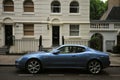 Knightsbridge residential and retail district in central Londonand a luxury Maserati car as a wealthy status symbol