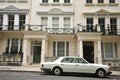Knightsbridge residential and retail district in central Londonand a luxury Rolls Royce car as a wealthy status symbol