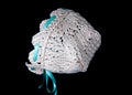 Knit cream color baby bonnet Royalty Free Stock Photo