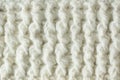 Knit texture of white wool knitted fabric with cable pattern as background. Royalty Free Stock Photo