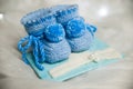 Knited new born shoes arranged as a gift