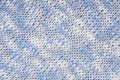 Knitted background, light blue and white colour, melange crocheted backdrop, coarse texture, soft surface, woollen,