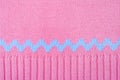 Knitted background. Pink wool jumper texture macro