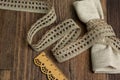 Knitted openwork linen ribbon tapes in rural style of rustics cotton eco natural on wood ground