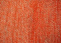 Knitted blanket orange. Christmas mood. The theme of the winter, warmth and comfort.
