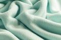Knitted cashmere green fabric texture with large fold