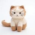 Adorable Knitted Cat On White Background - Cute And Colorful Toy Royalty Free Stock Photo