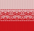 Knitted christmas red and white floral geometric ornament. Xmas knit winter sweater texture design. Royalty Free Stock Photo