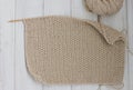 Knitted cloth on wooden background. copy space Royalty Free Stock Photo