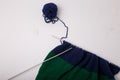 Knitted clothing, accessory in process of making. Knitting needles and ball of threads, yarn on white background. Striped blue,