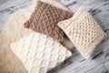 Knitted cushions of natural shades Royalty Free Stock Photo