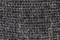 Knitted fabric made of grey merino wool, textured