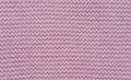Knitted fabric made of pink wool threads, pigtail pattern, full frame Royalty Free Stock Photo