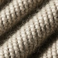 Knitted fabric, potentially wool. The texture shows a series of interlocking Royalty Free Stock Photo