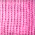 Knitted fabric texture background in pink color. Color Wallpaper Royalty Free Stock Photo