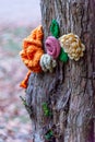 Knitted Flower on tree bark Royalty Free Stock Photo