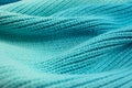 Knitted graduated turquoise shades of wool wave effect background