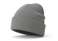 A knitted grey beanie hat with a folded cuff presented isolated on white background Royalty Free Stock Photo