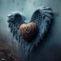 A knitted handmade blue and brown heart