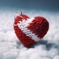 A knitted handmade red and white heart