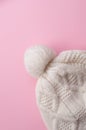 knitted hat on pink background