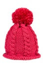 Knitted hat with a pompon