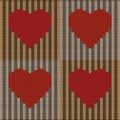 Knitted hearts on a brown background