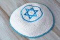 Knitted kippah with embroidered blue and white Star of David