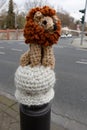 A knitted lion as an outdoor pole topper on the street in Bochum, Germany