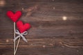 Knitted Love hearts on a wooden background, valentines day post card concept