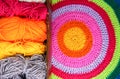 Knitted mat and colorful skeins of wollen yarn Royalty Free Stock Photo