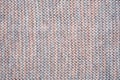 Knitted melange multicolor background from woollen yarns. Texture of a knitted fabric