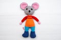A knitted mouse. A soft toy as a symbol of the New Year. Royalty Free Stock Photo
