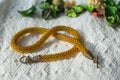 Knitted necklace from brilliant yellow beads