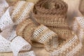 Knitted openwork linen ribbon tapes in rural style of rustics cotton eco natural Royalty Free Stock Photo