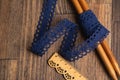 Knitted openwork linen ribbon tapes in rural style of rustics cotton eco natural on wood ground