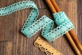 Knitted openwork linen ribbon tapes in rural style of rustics cotton eco natural on wood ground