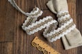 Knitted openwork linen ribbon tapes in rural style of rustics cotton eco natural on wood ground