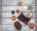 Knitted pattern on circular needles from brown woolen yarn and wood ornaments Royalty Free Stock Photo