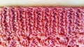 Knitted pattern with crochets of thread forming beautiful, even holes. The gum is knitted according to the pattern: one front loop Royalty Free Stock Photo