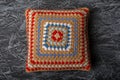 Knitted Pillow made of cotton threads with a pattern, white, red and pale blue, Royalty Free Stock Photo