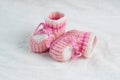 Knitted pink baby boots