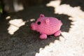 Knitted pink pig with crimson vest on white background, mini pig, handmade, toys