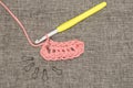 Knitted Pink Yarn, Crochet Hook, and Stitch Locks Royalty Free Stock Photo