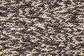 Knitted plaid blanket grey melange texture background