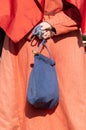 Knitted purse made of fabric in the hands of a woman. Close-up