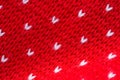 Knitted red wool background closeup. Christmas blanket or sweater Royalty Free Stock Photo