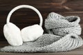 Knitted scarf with fluffy earmuffs