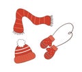 Knitted seasonal winter accessories. A set of traditional winter clothes. A hat with a pompom, a scarf, mittens Royalty Free Stock Photo