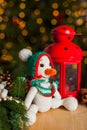 Knitted snowman toy under the Christmas tree Royalty Free Stock Photo